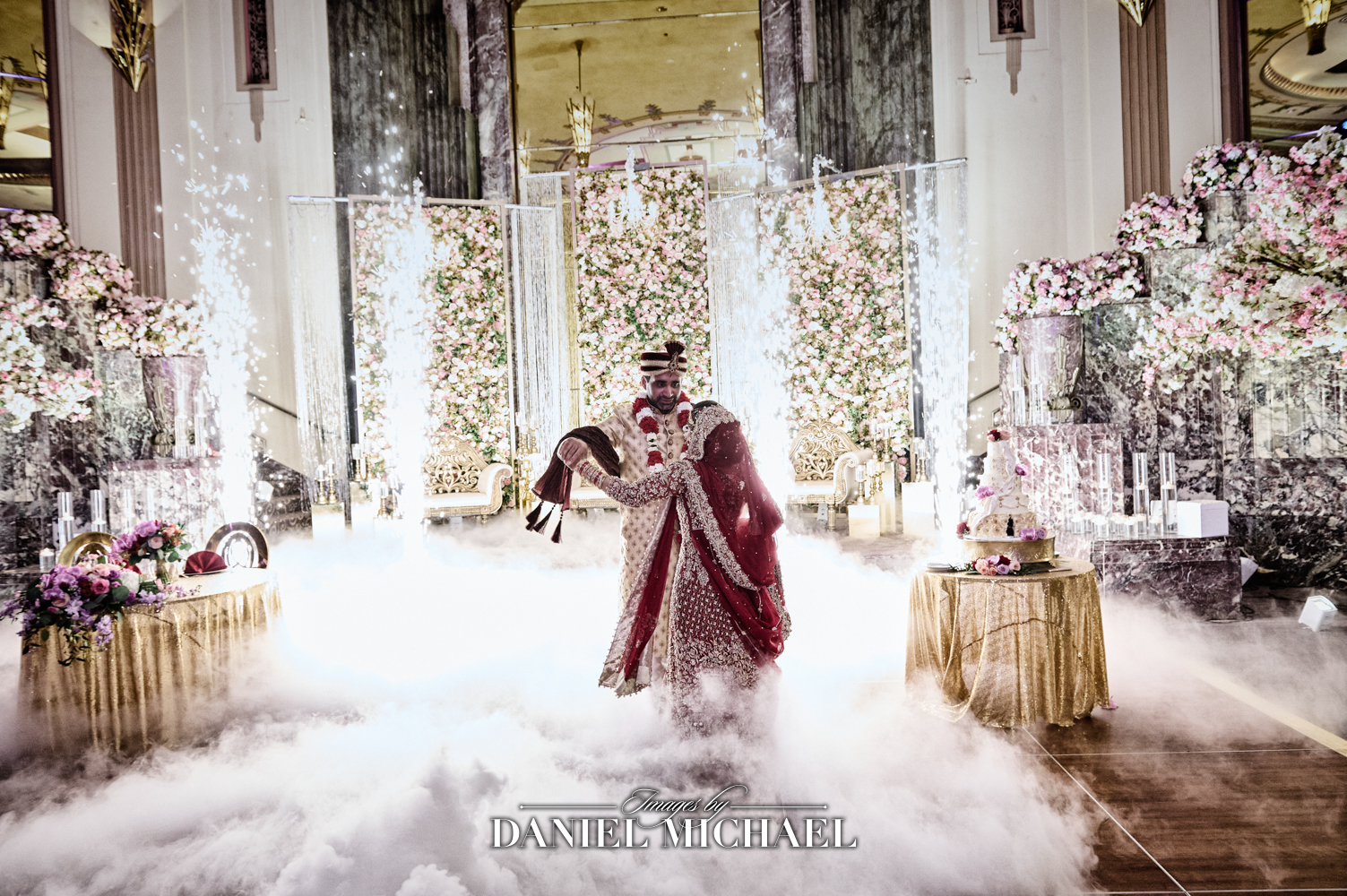 Muslim wedding celebration featuring a dancing couple with a dramatic cold spark and cloud effect